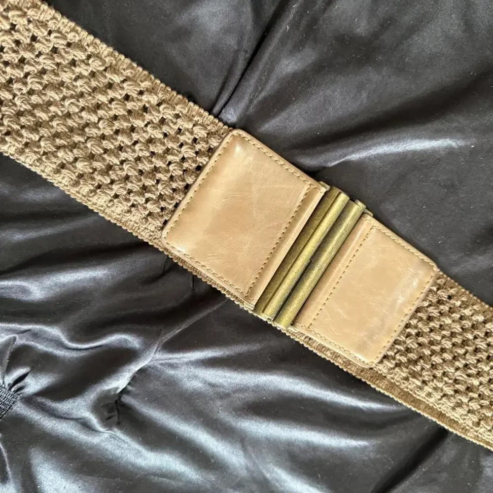 Tan woven belt with gold buckle